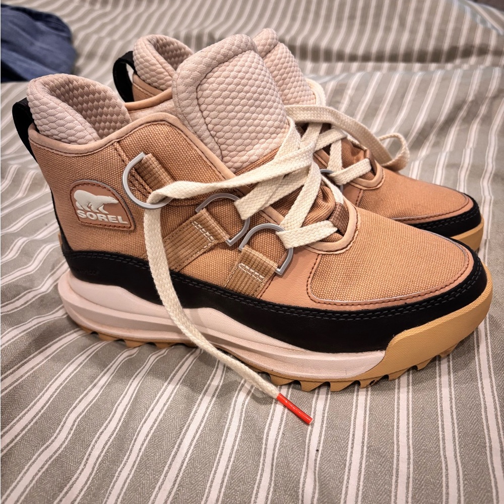 Sorel Beige and Black High-Top Boots